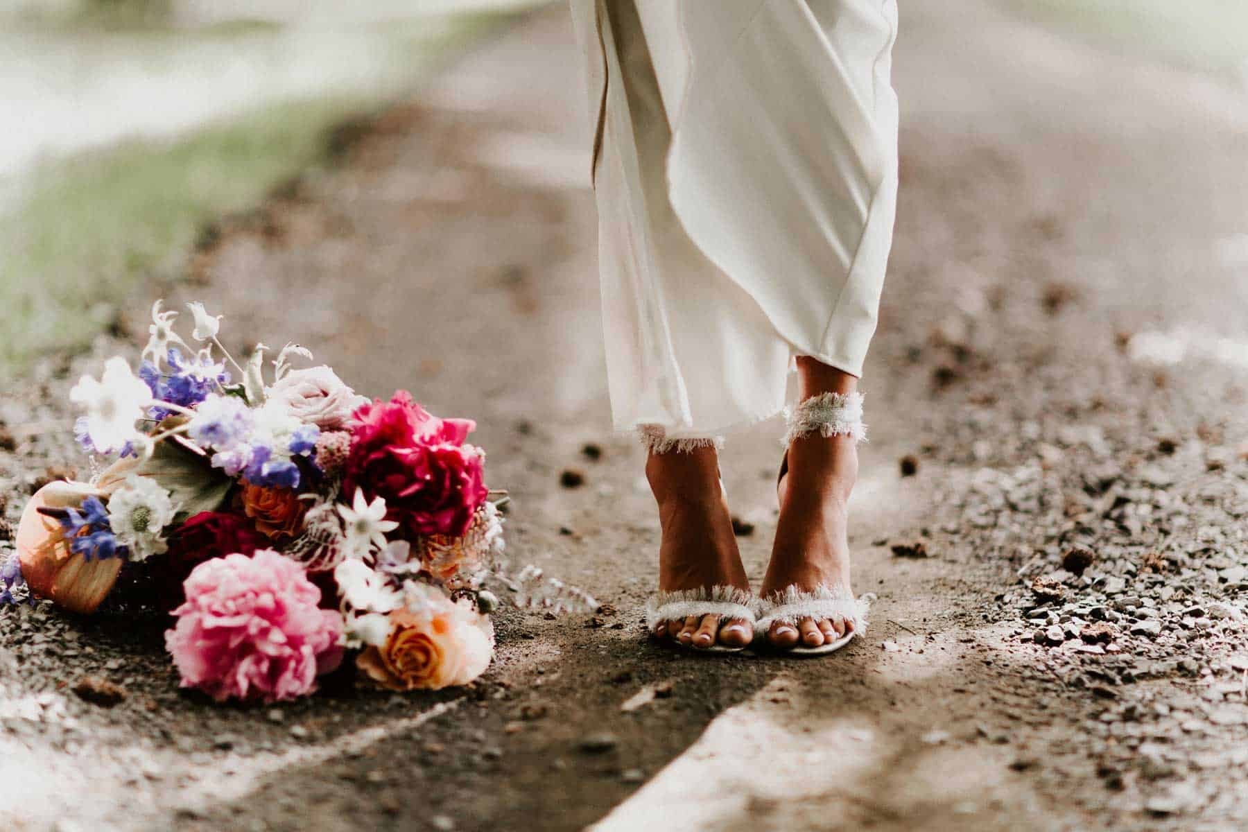 wedding shoes and colourful bridal bouquet