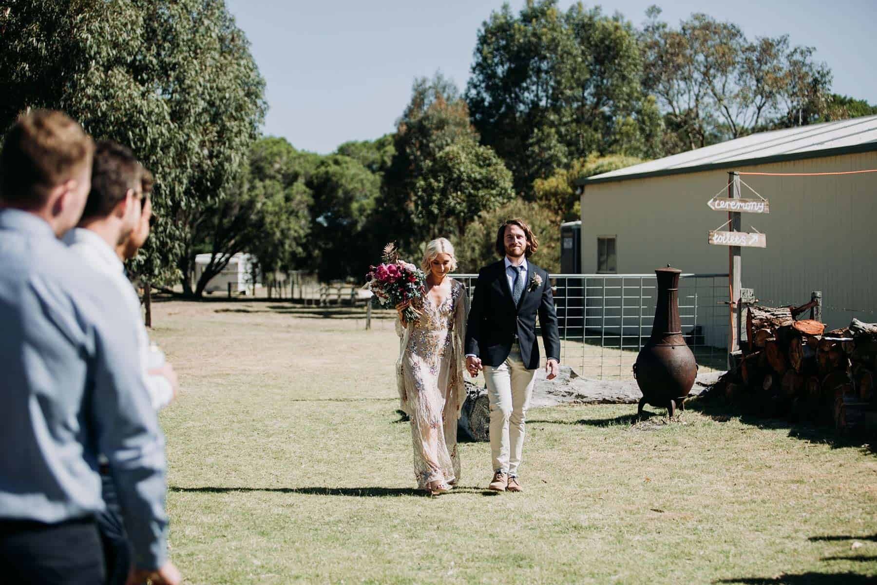 bride and groom walking down the aisle together