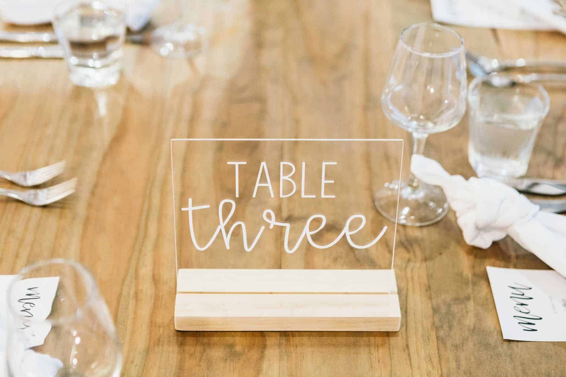 clear perspex table number with white lettering