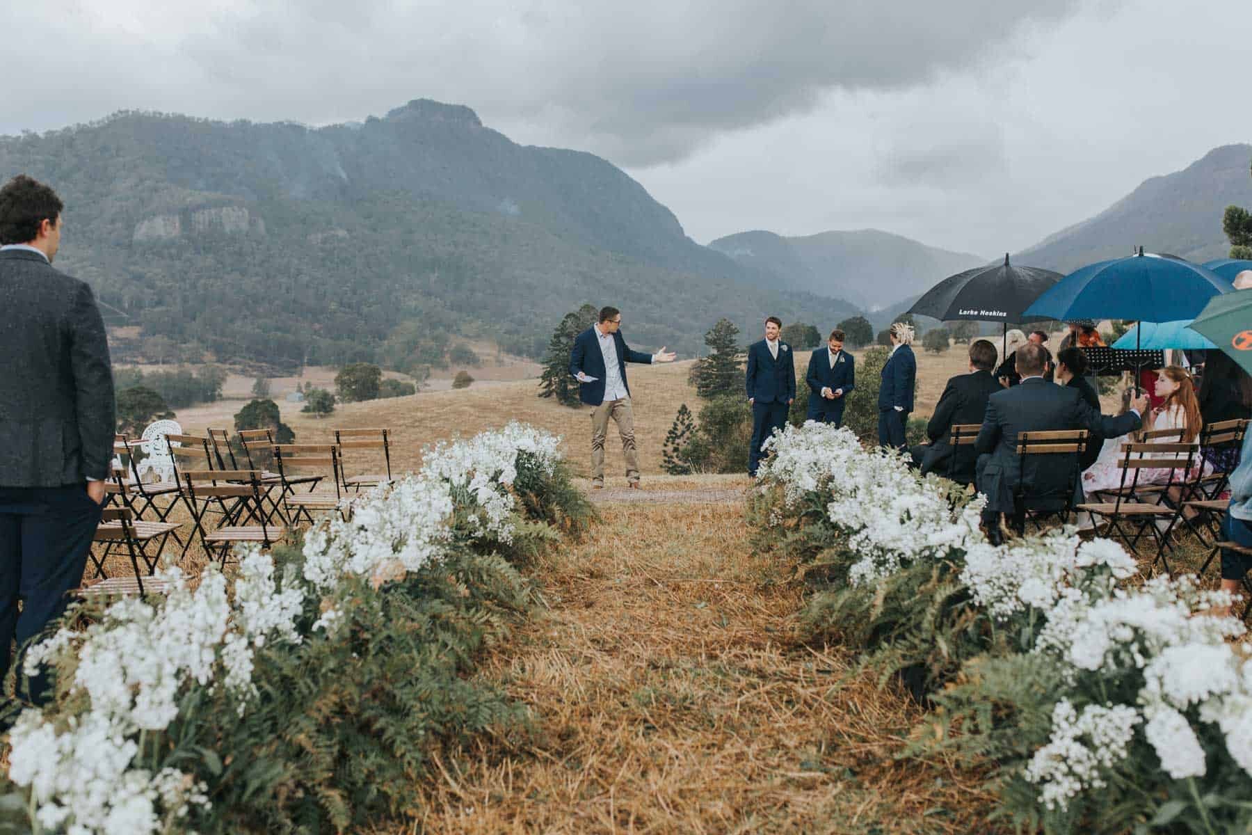 mountain wedding with white flower aisle