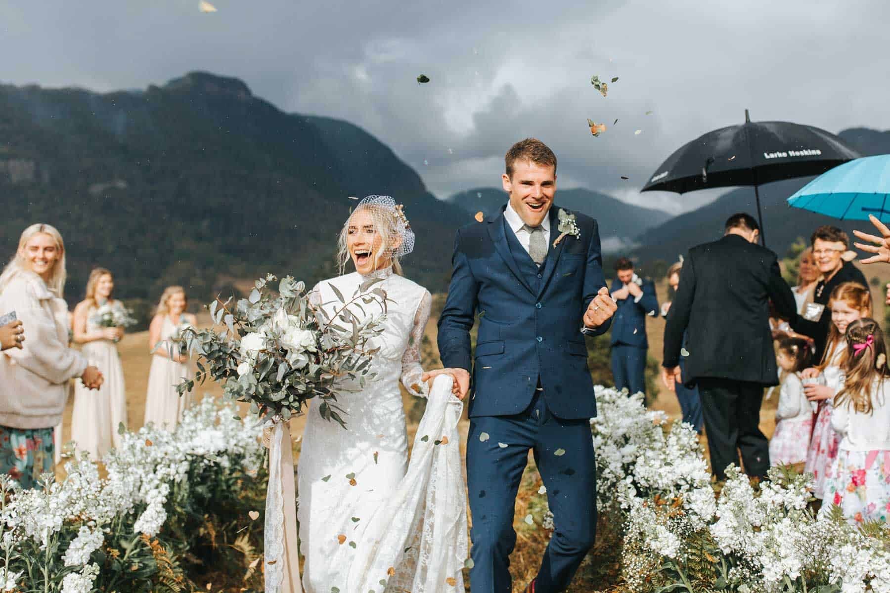 mountain wedding with white flower aisle