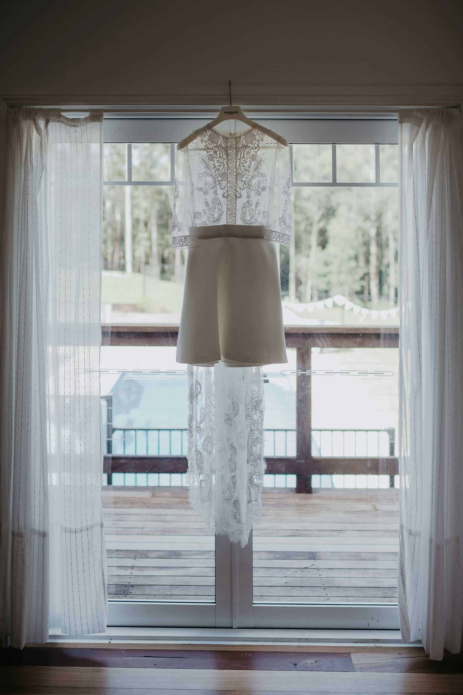 short wedding dress with lace bodice and long sleeves