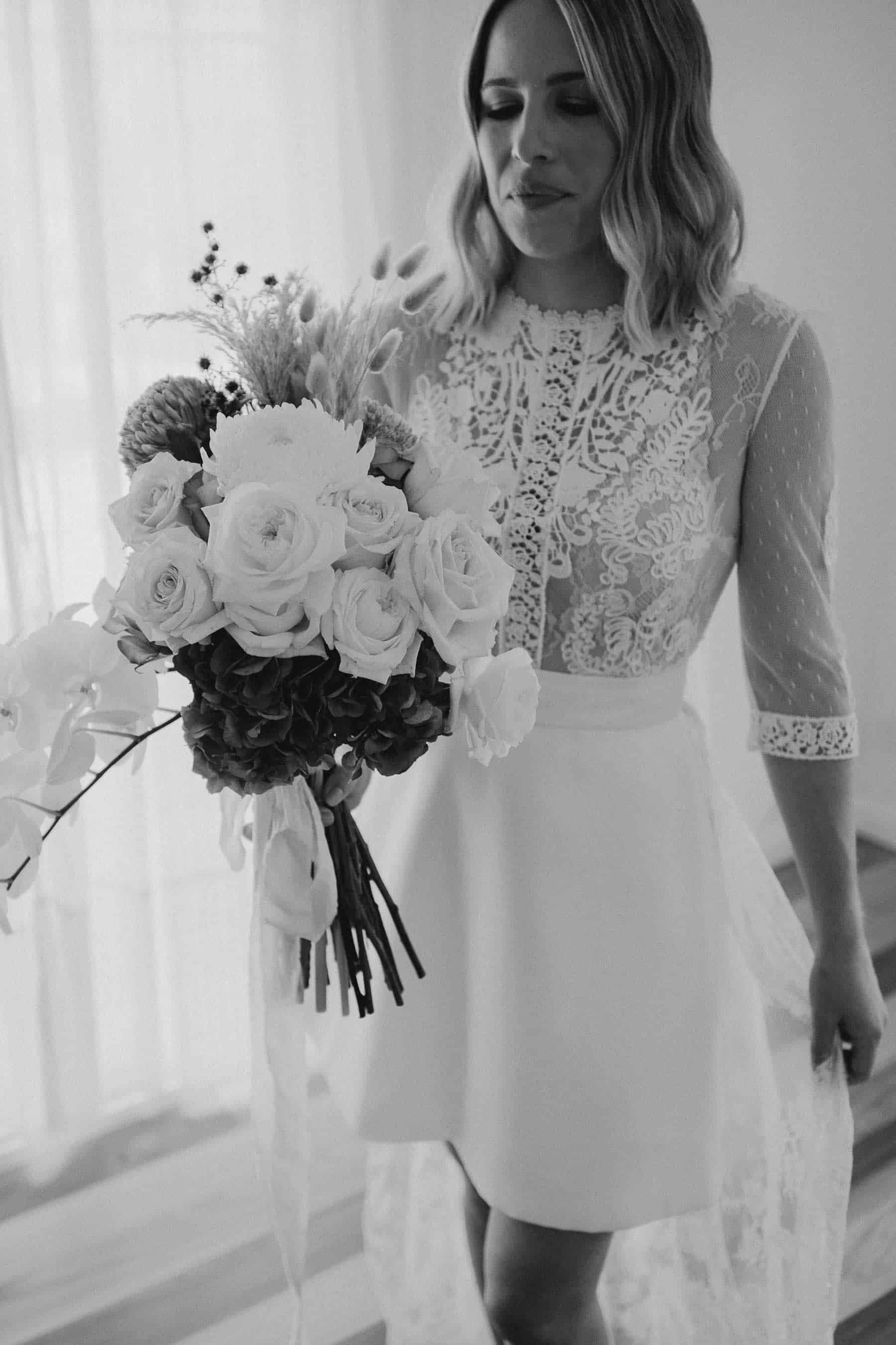 short wedding dress with lace bodice and long sleeves