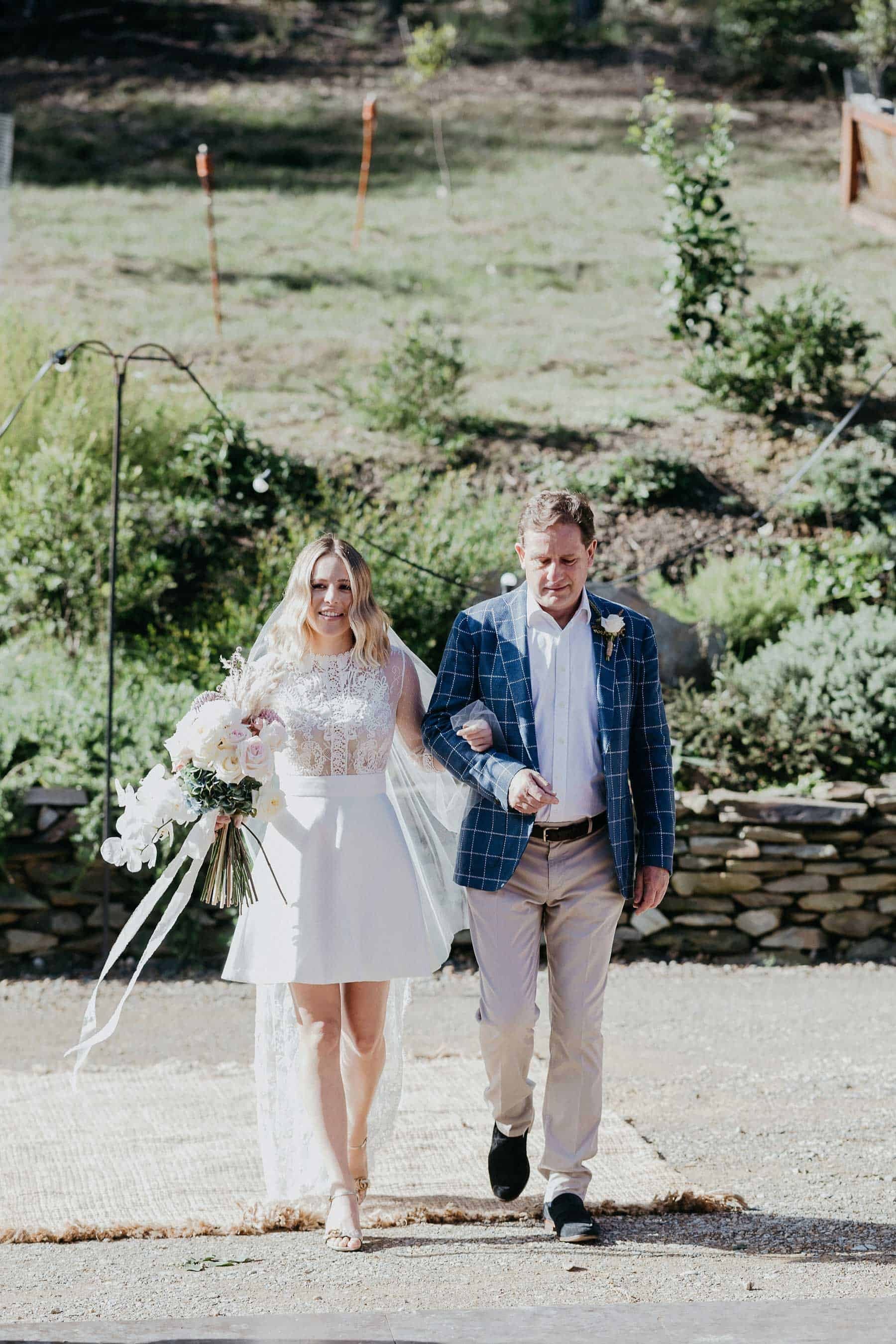 short wedding dress with lace bodice and long sleeves