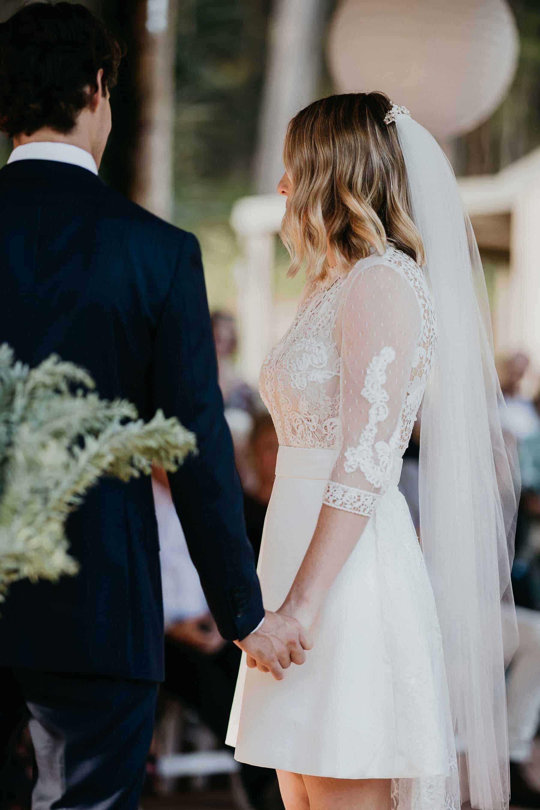 short wedding dress with lace bodice and long sleeves