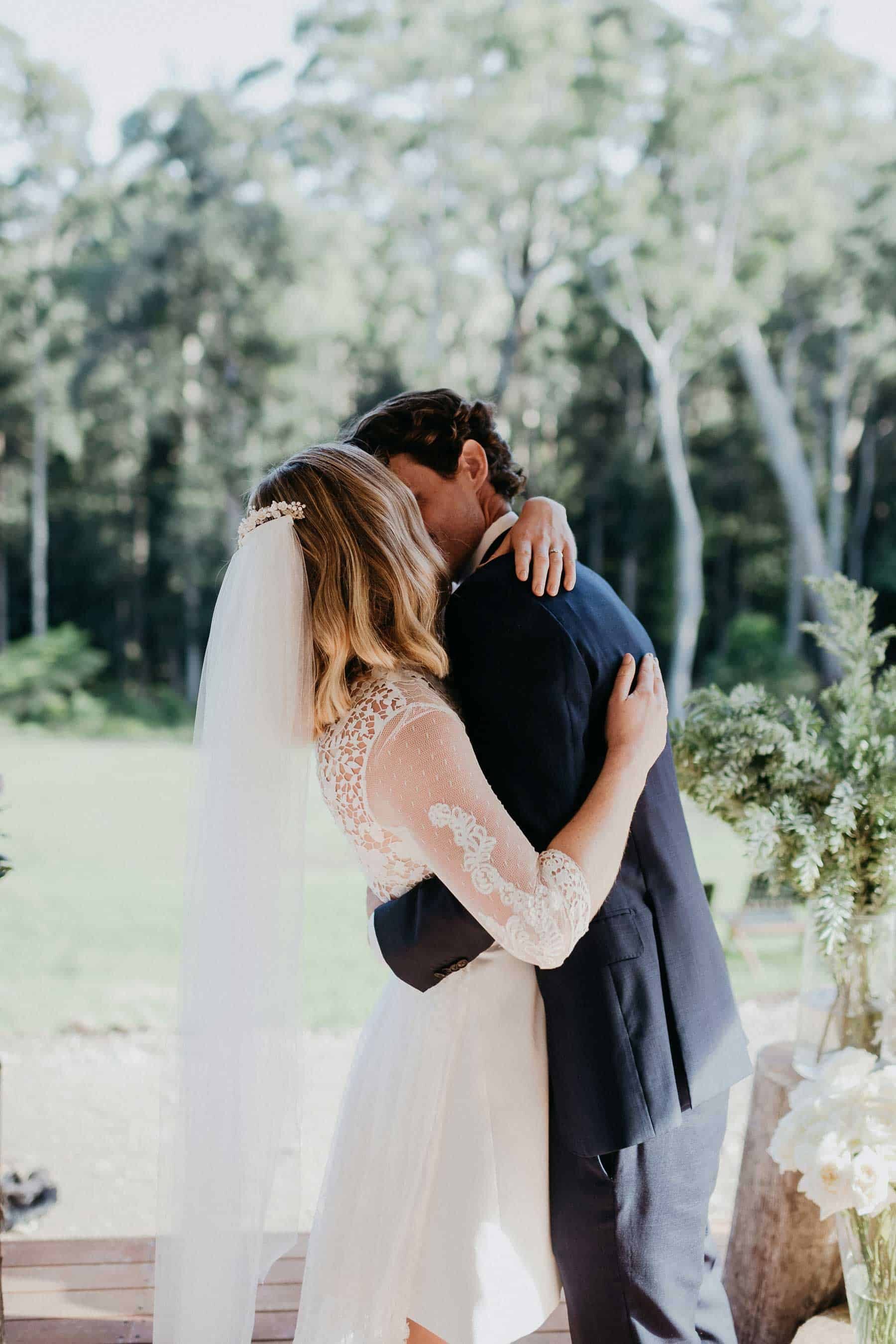 short wedding dress with lace bodice and long sleeves