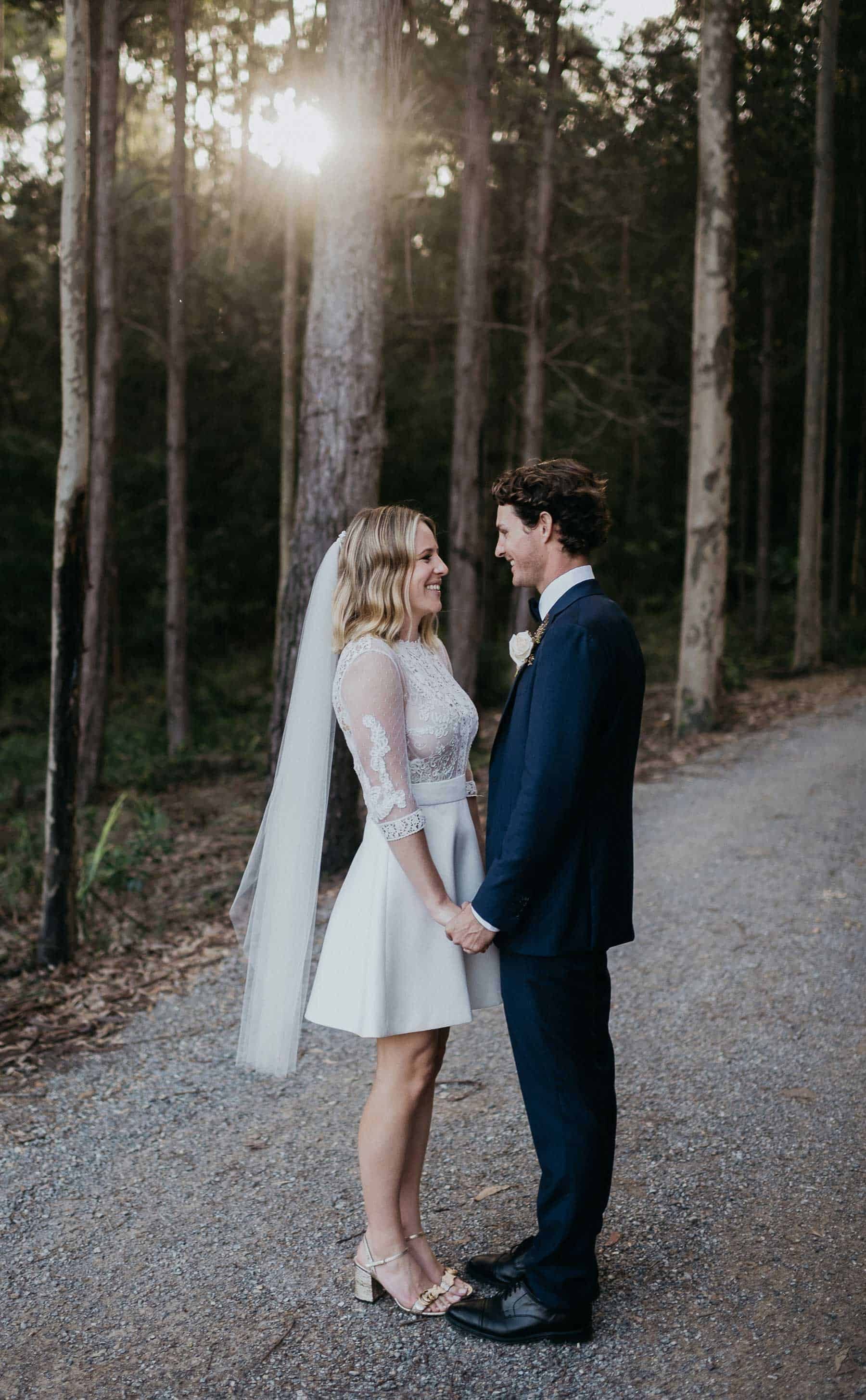 short wedding dress with lace bodice and long sleeves