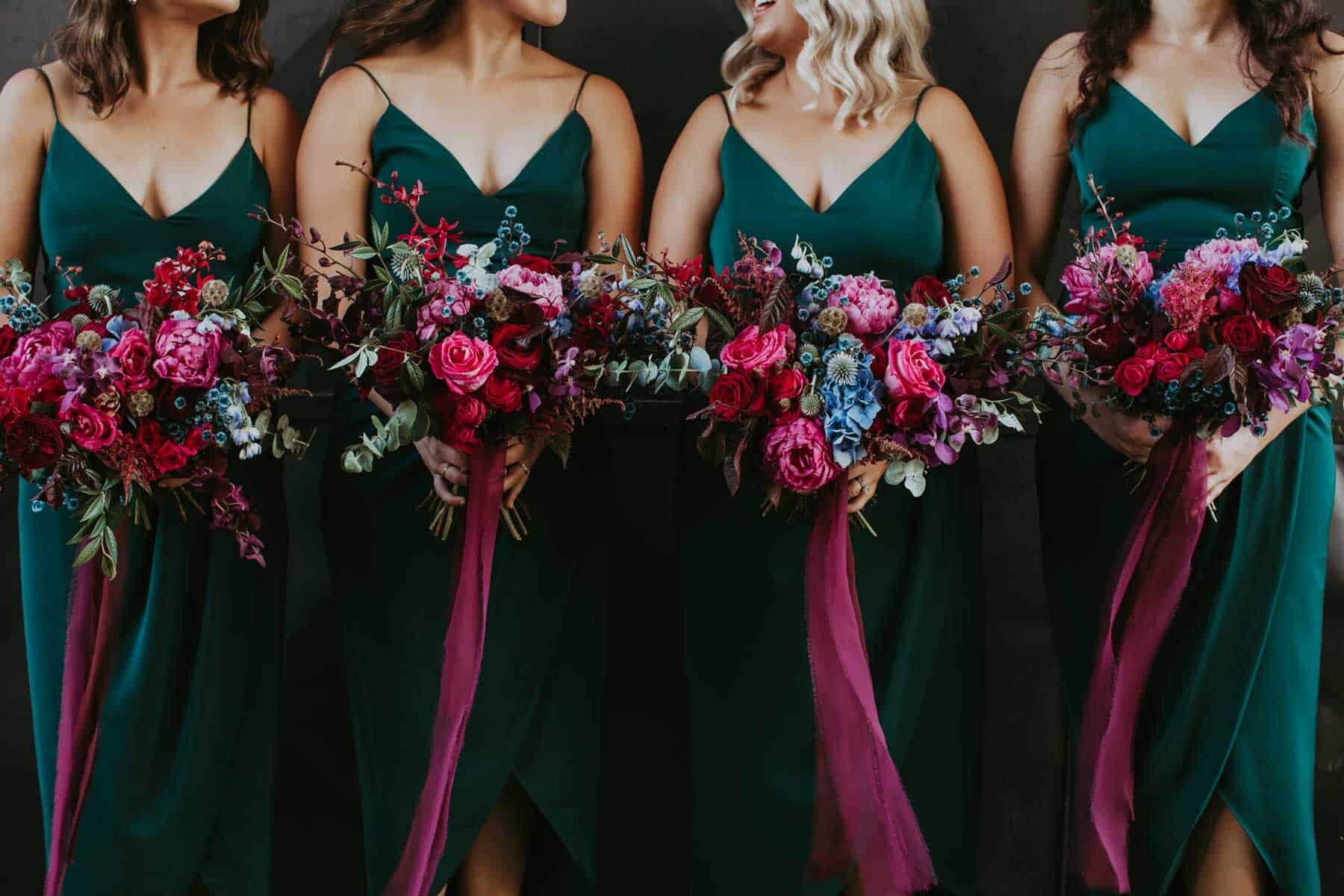 emerald green bridesmaid dresses and pink bouquets
