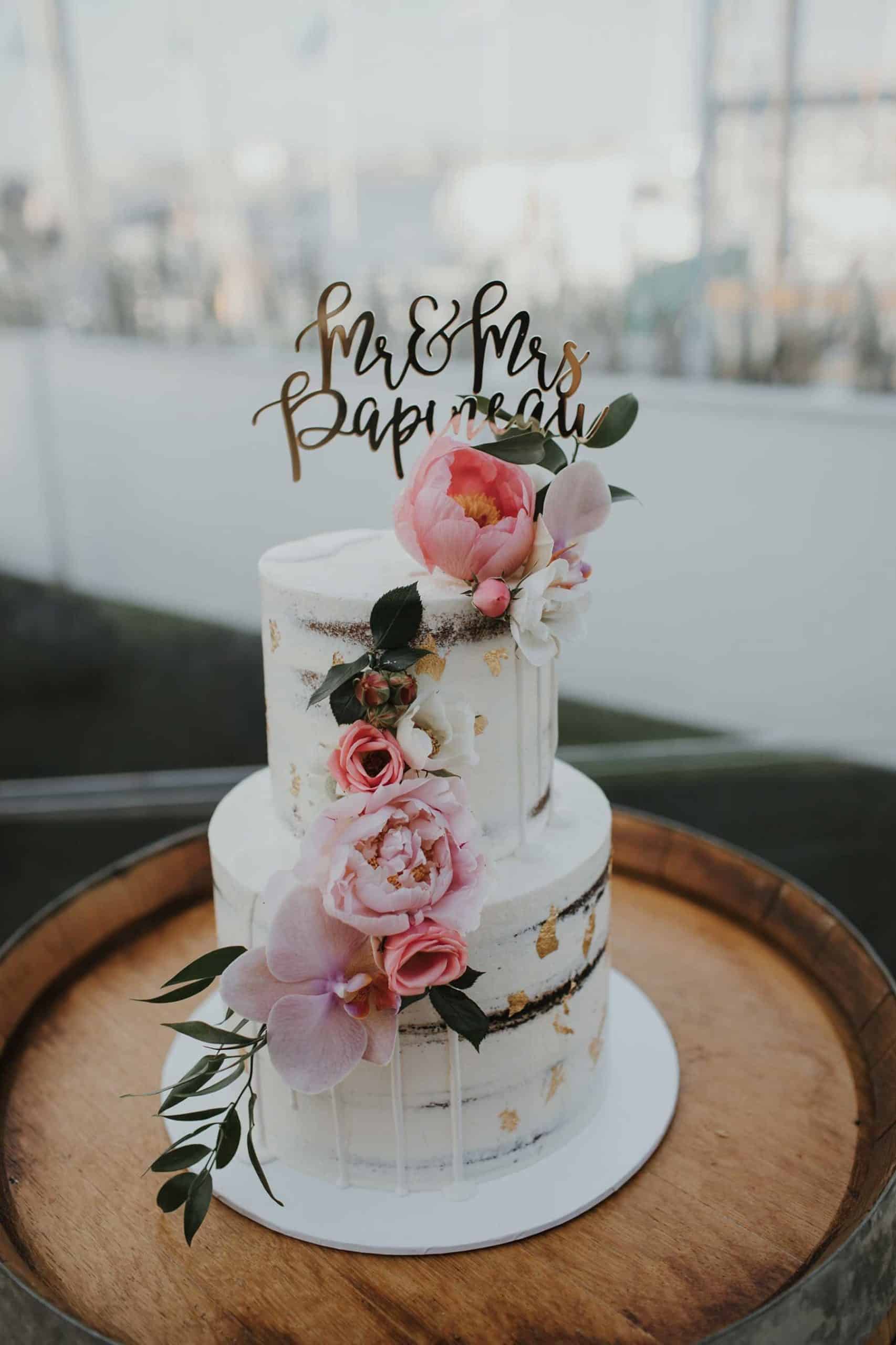 best wedding cakes of 2019 - simple cake with gold fleck and fresh flowers