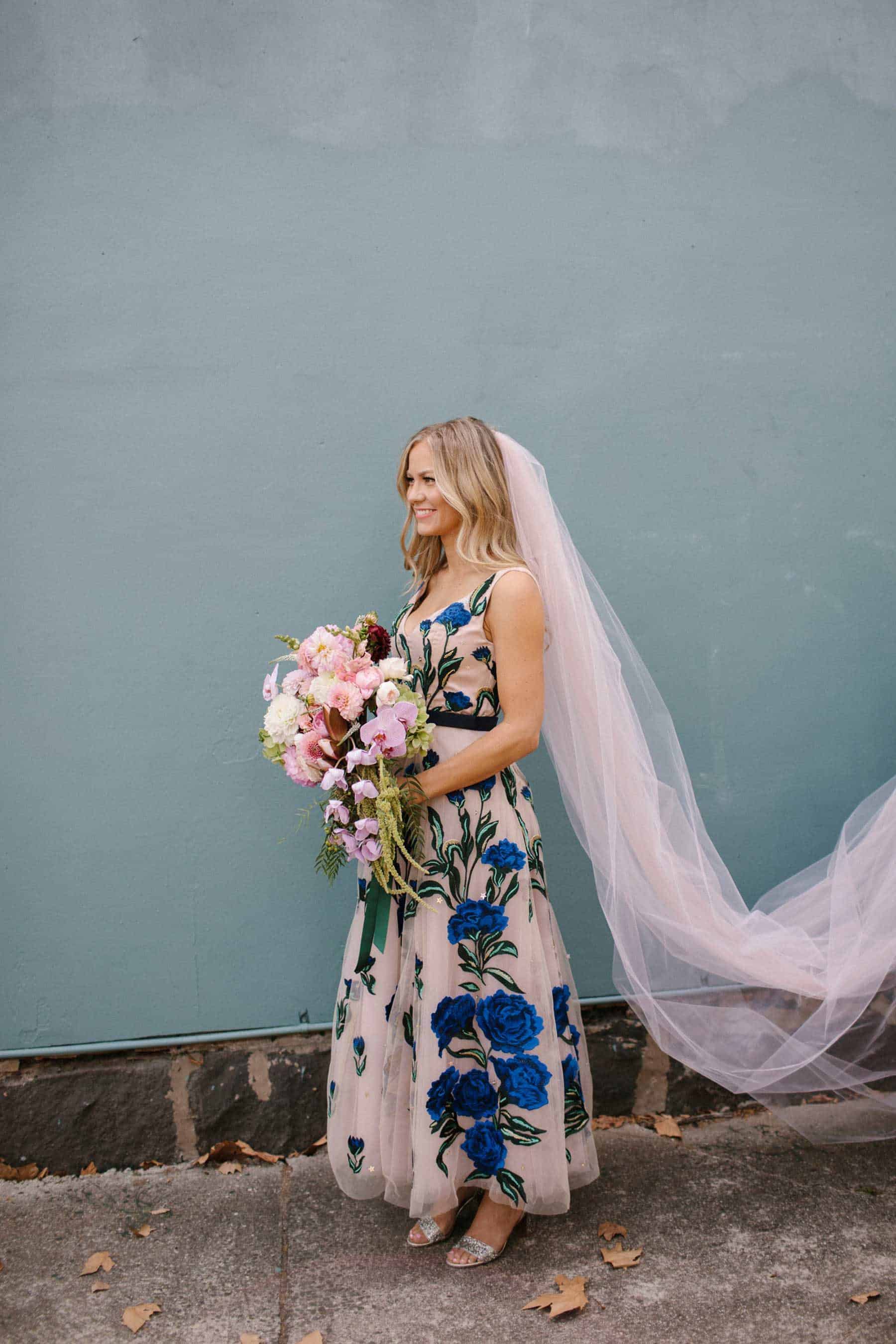 Best wedding dresses of 2019 - blush dress with blue floral applique