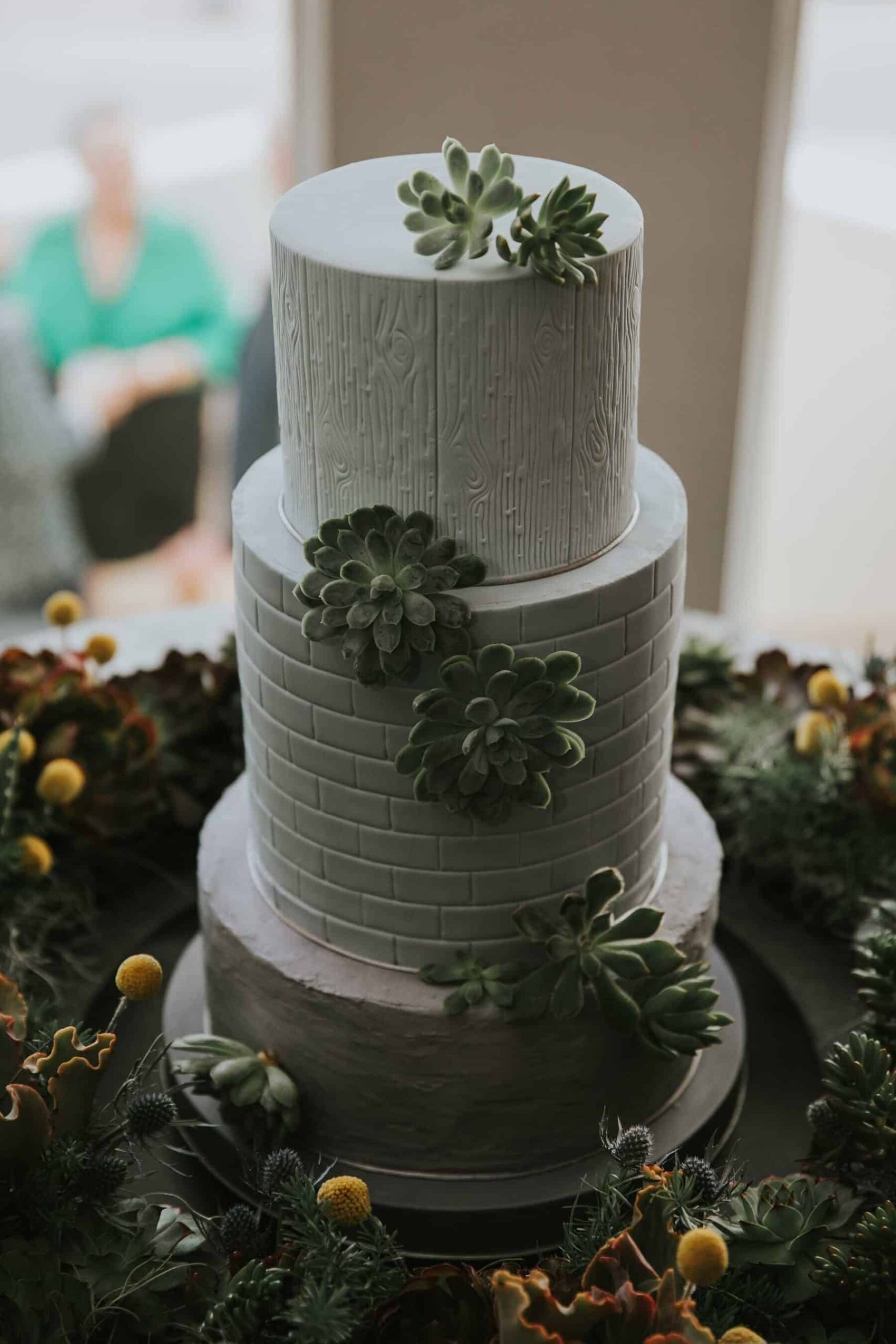 blue wedding cake with succulents