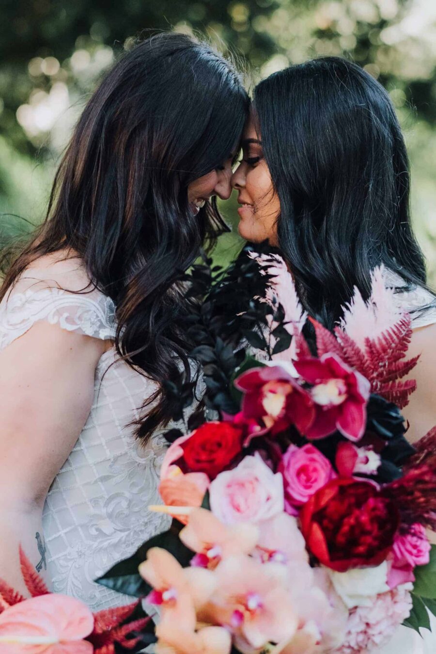 two brides with pink bridal bouquets
