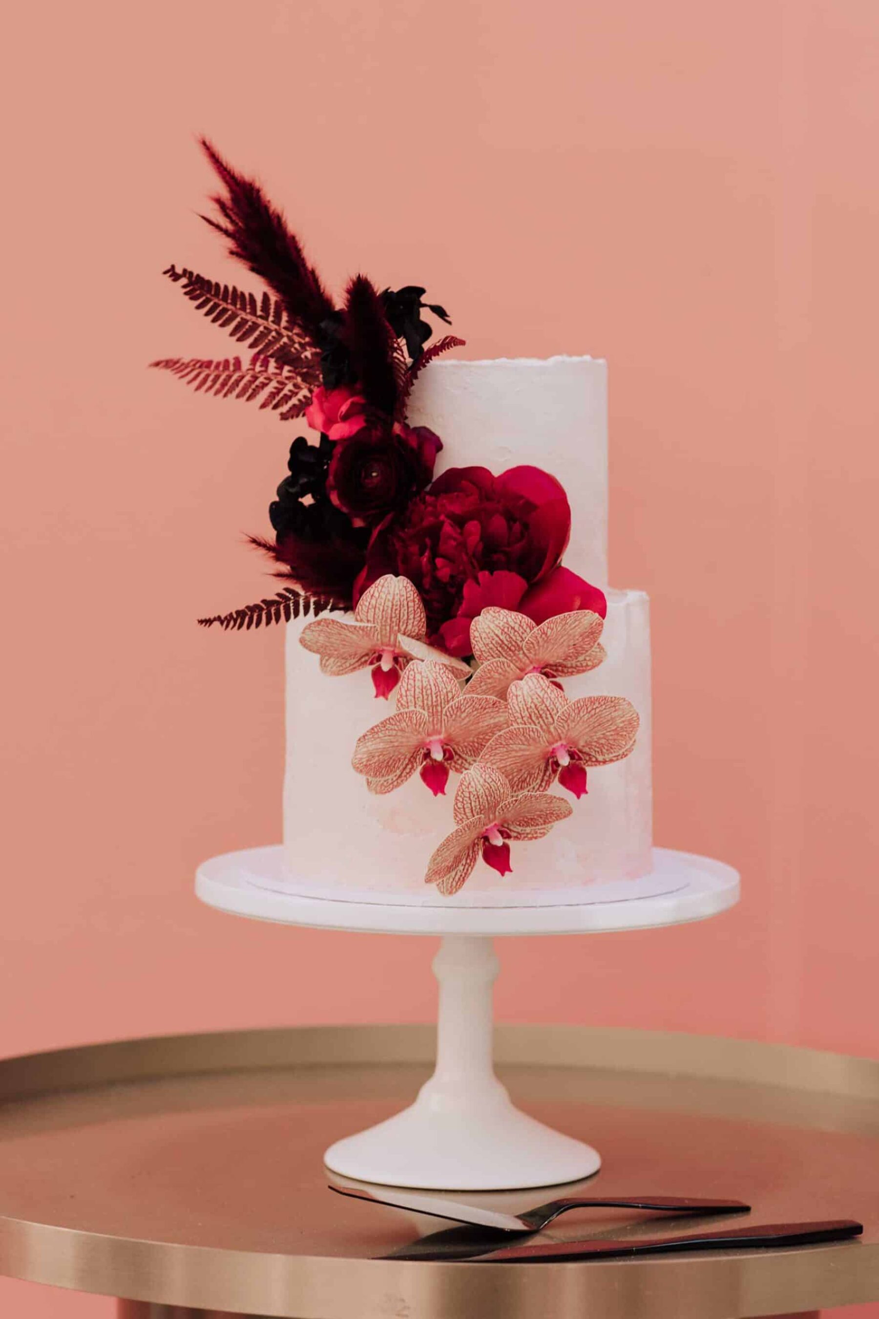 modern wedding cake with pink flowers