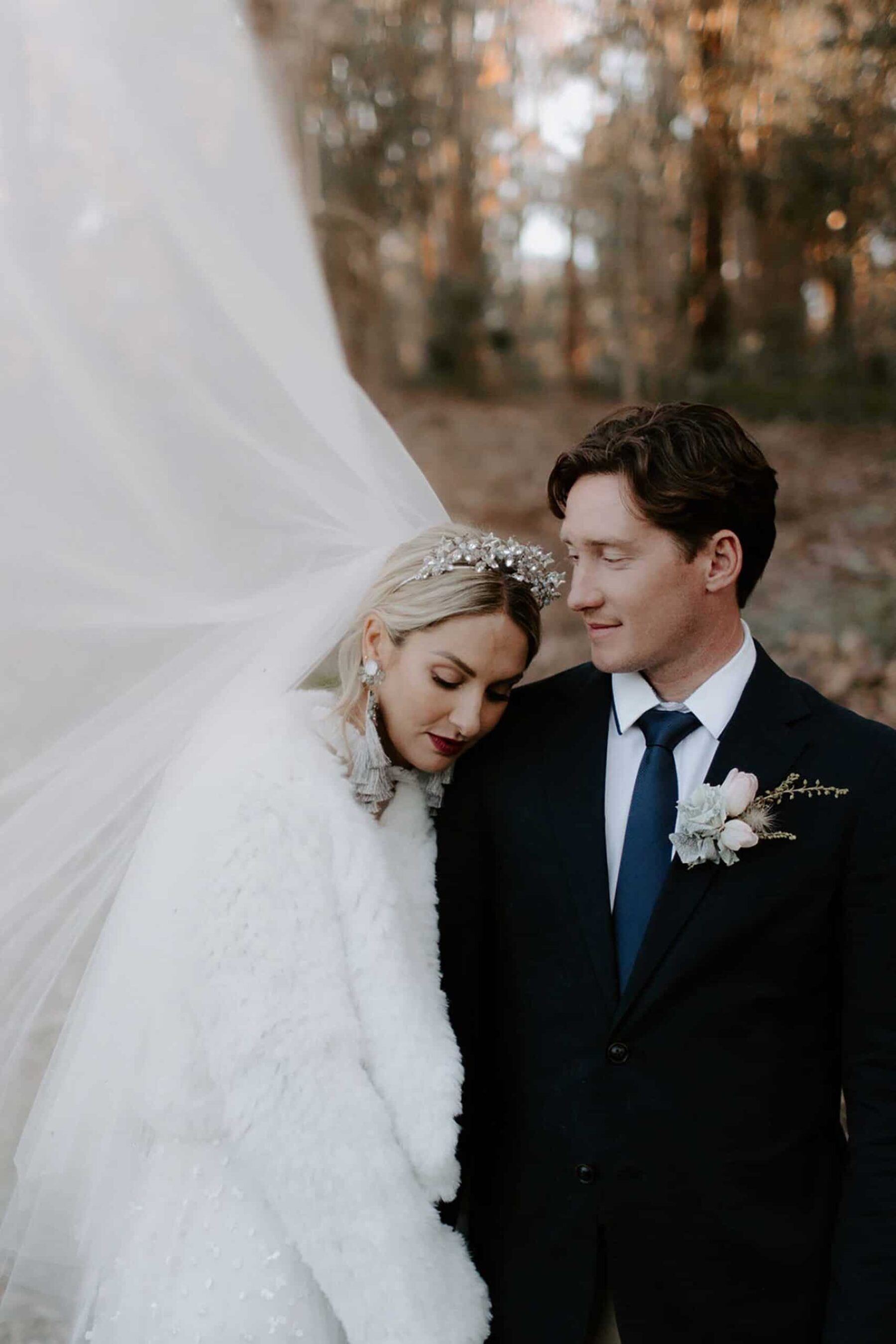 winter bride with faux fur coat and golden crown