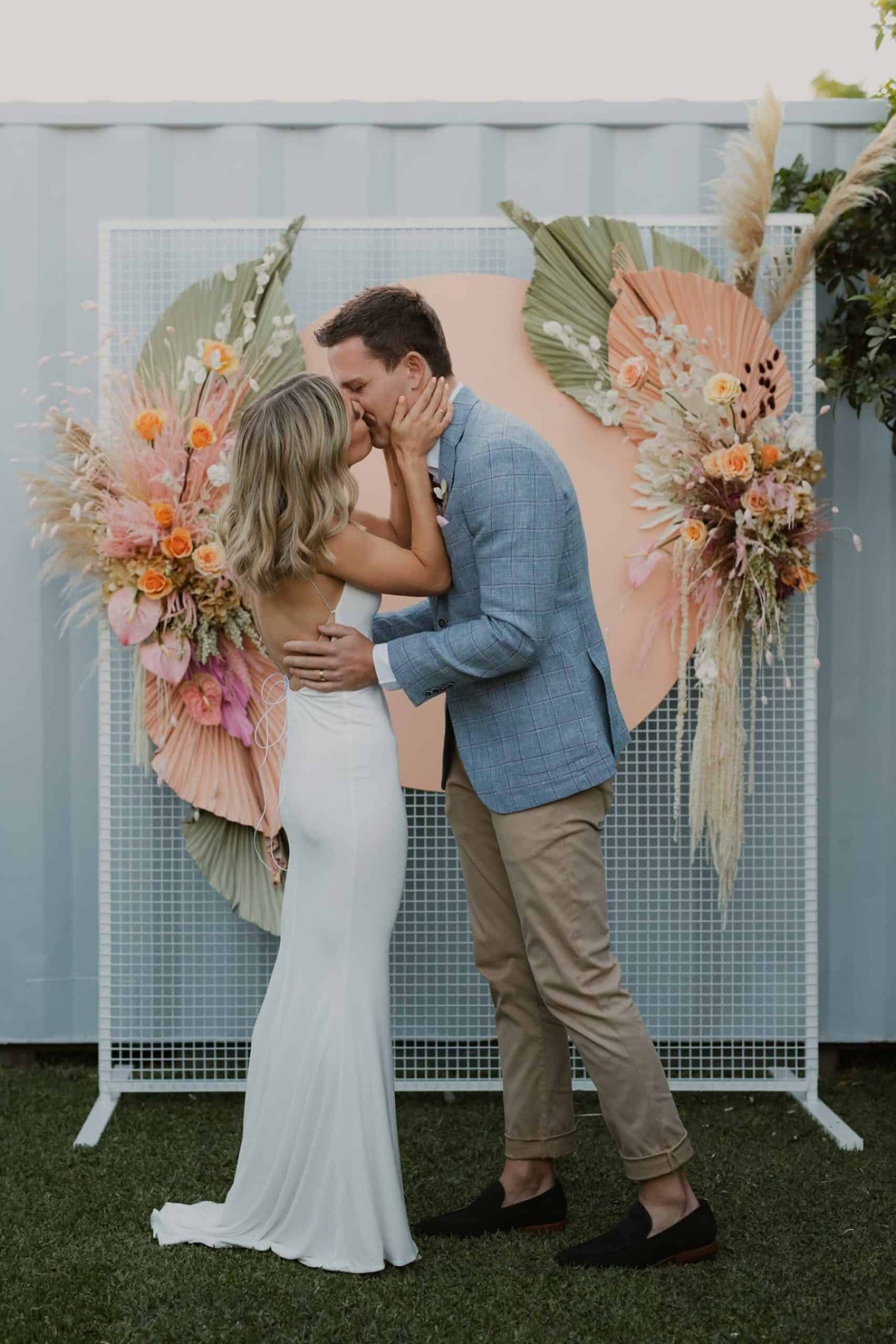 pastel pink circle arbour with painted palm leaves