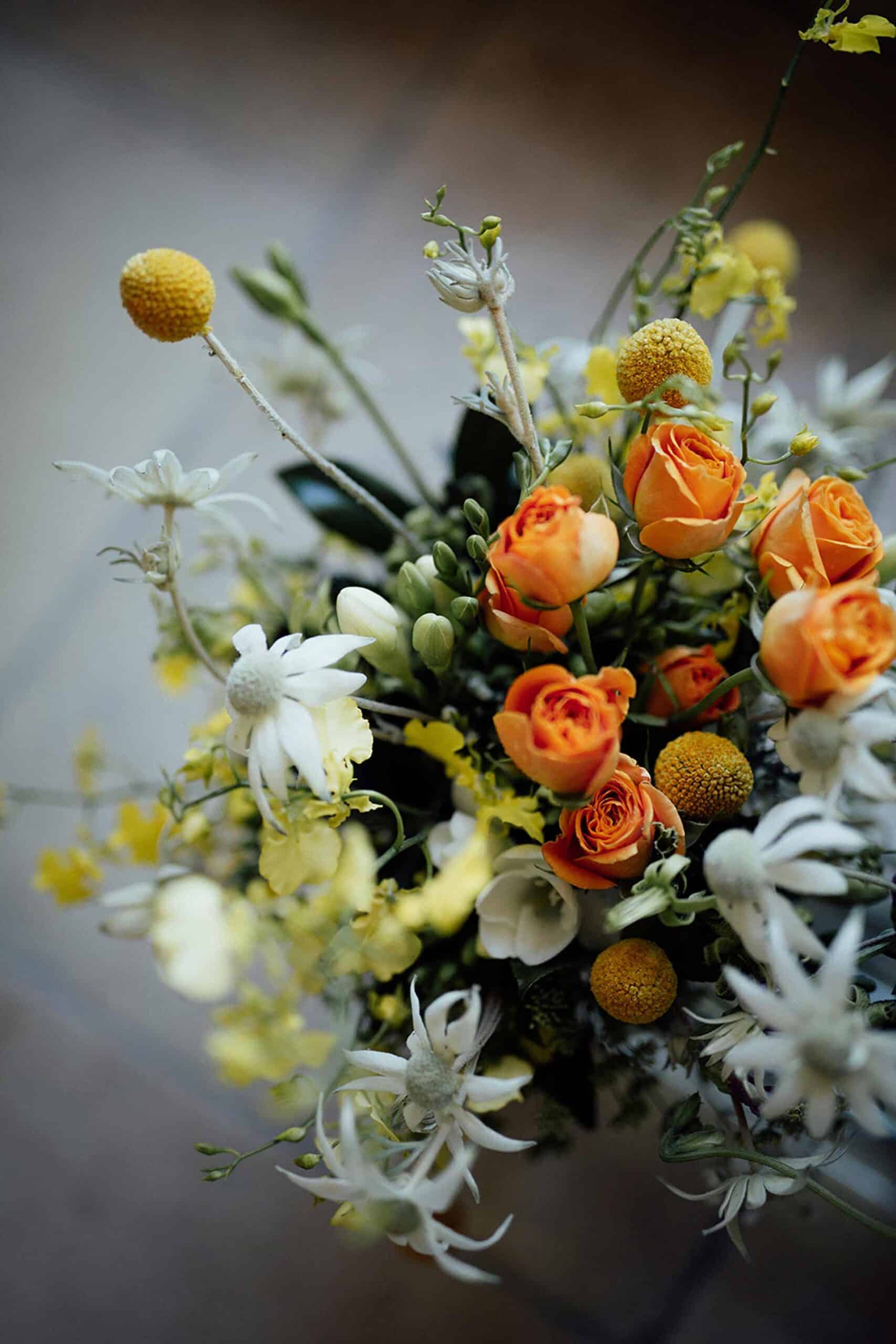 unstructured bridal bouquet with orange roses