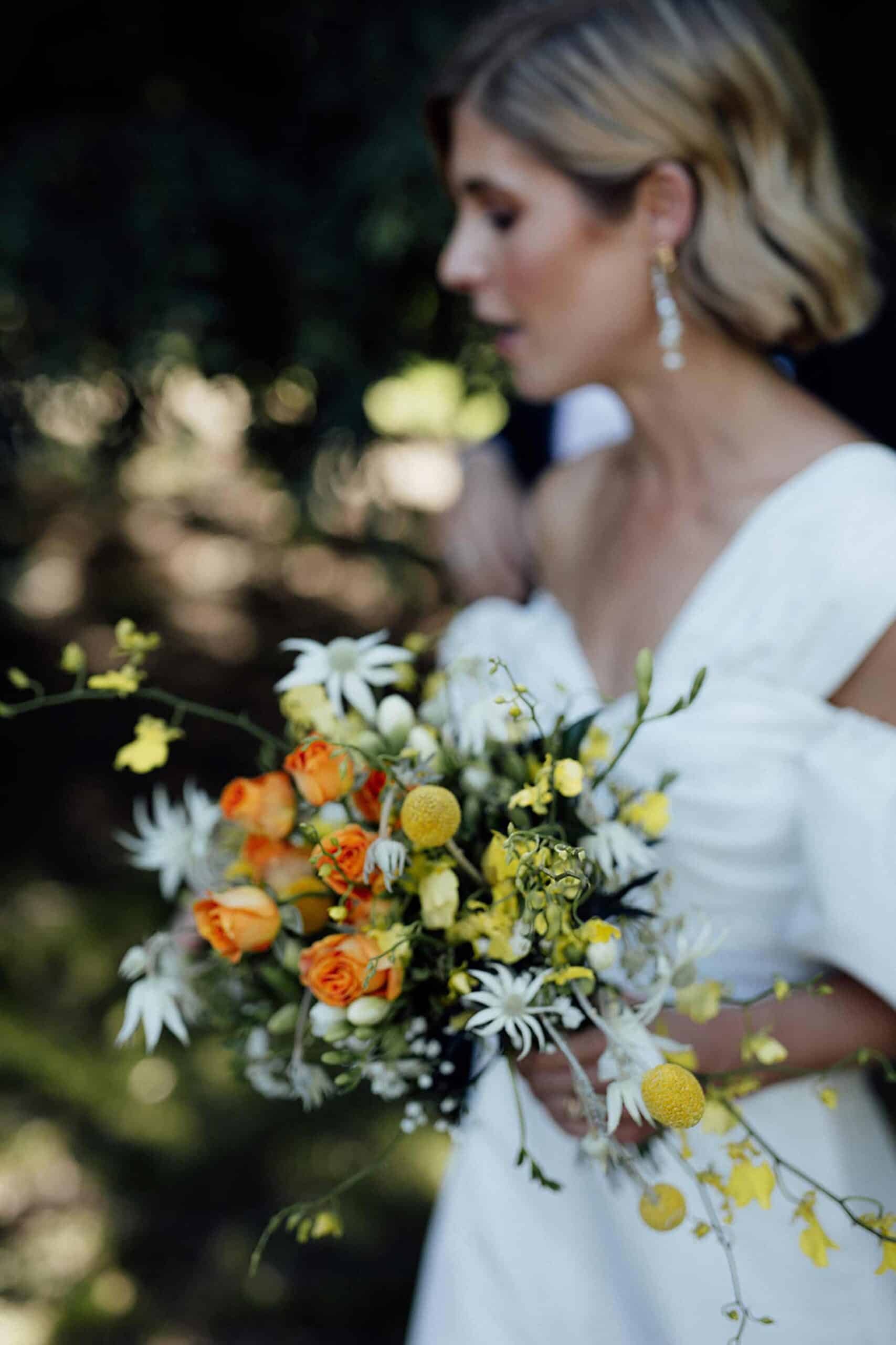 unstructured bridal bouquet with orange roses