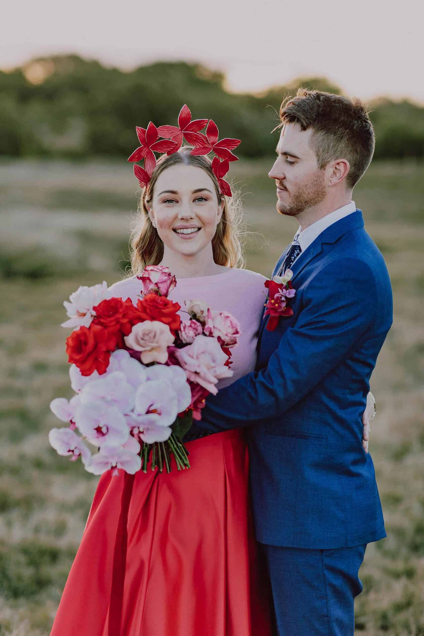bride in red skirt and pink top