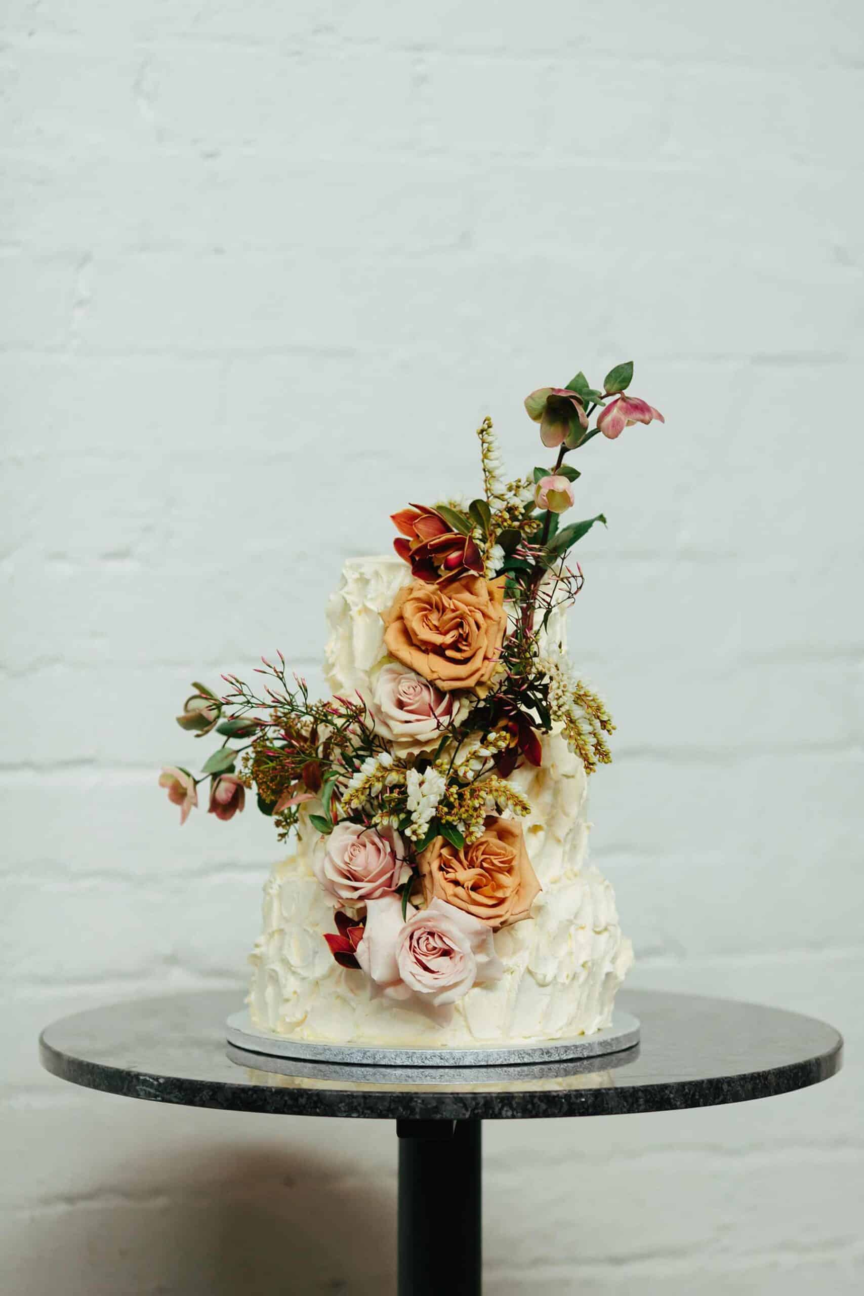 rustic wedding cake with fresh flowers