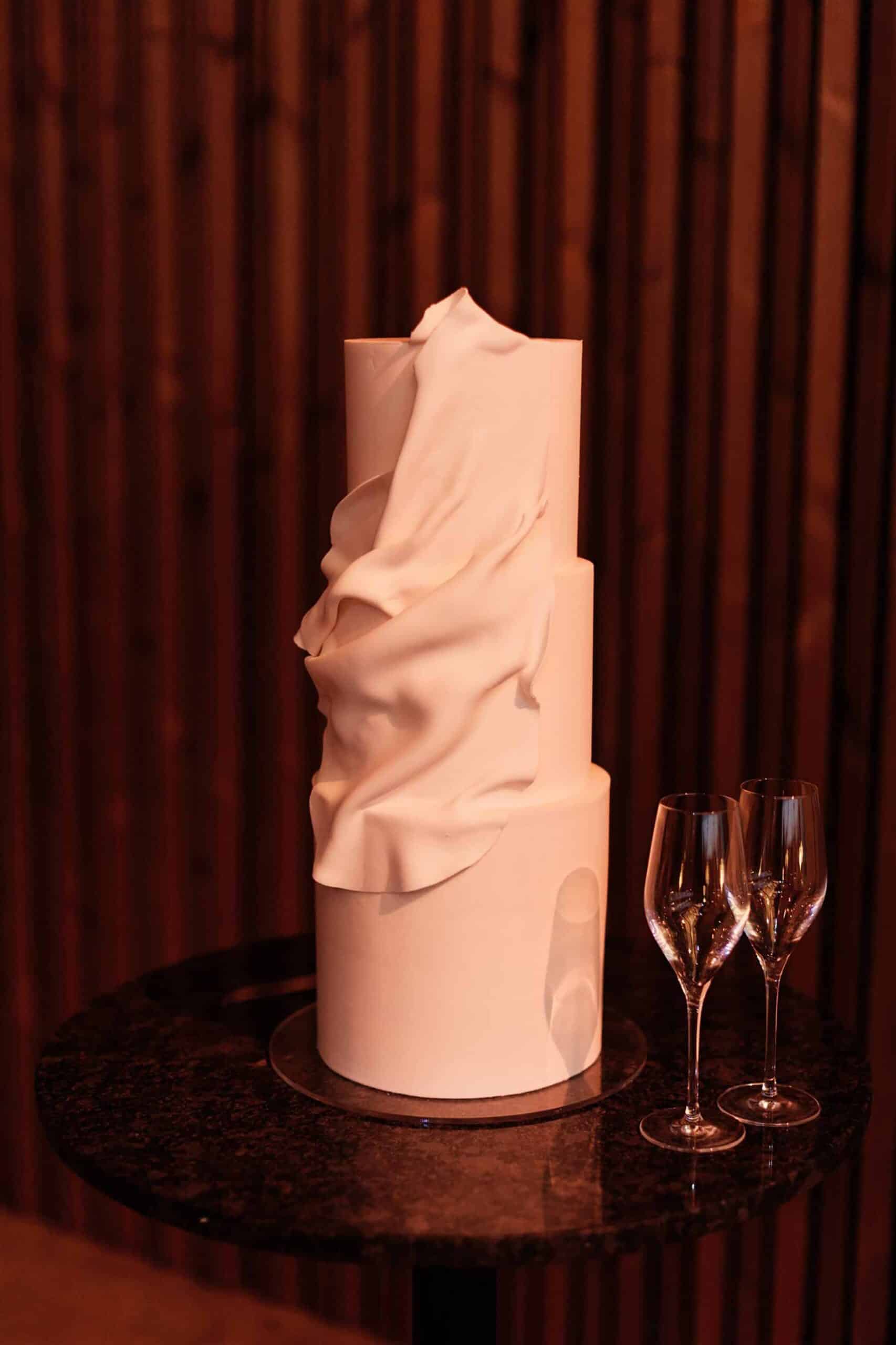 minimal three tier wedding cake with drape effect