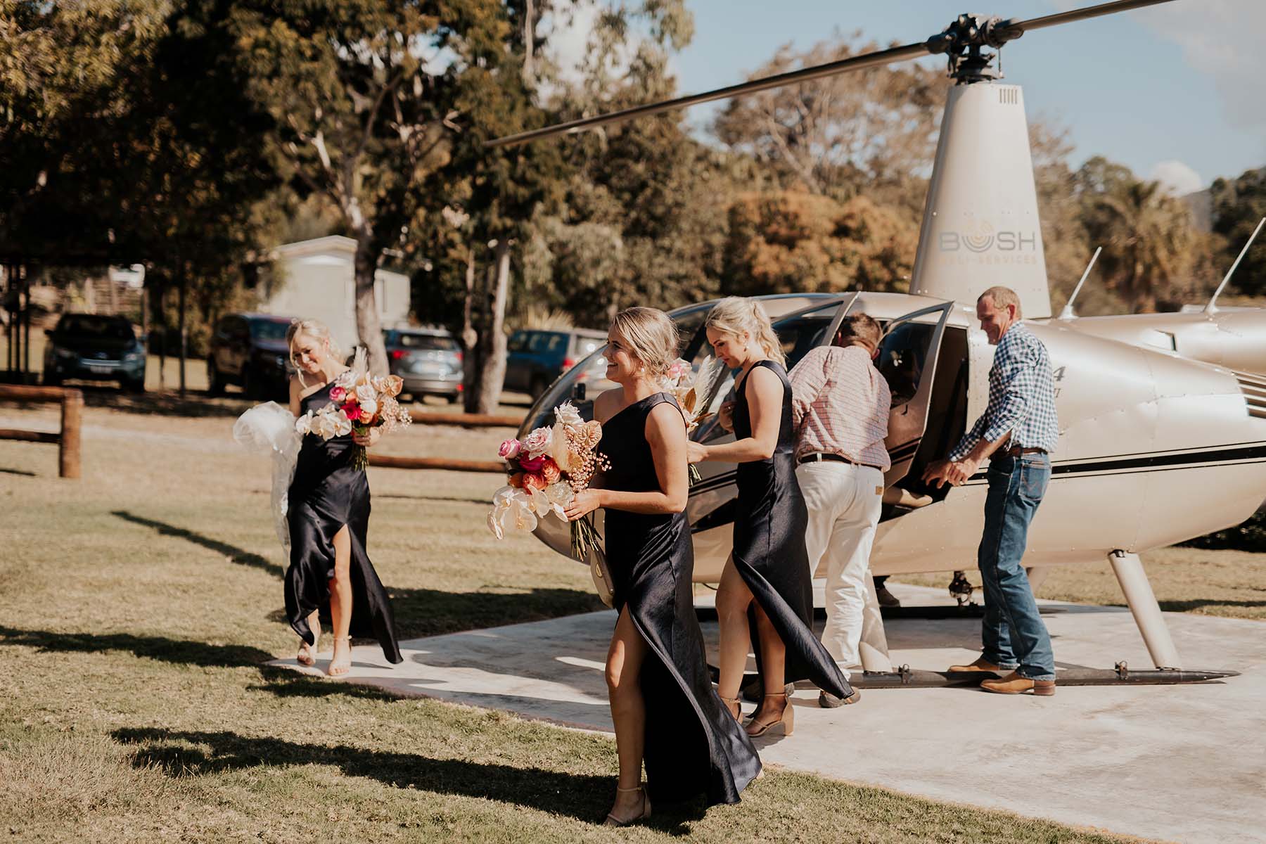 Bridesmaids coming out of helicopter
